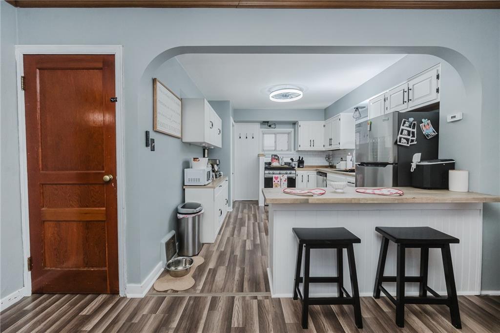 426 Grant Street Indiana, PA 15701 - Photo 11 of 33 a kitchen with stainless steel appliances granite countertop a refrigerator and a sink