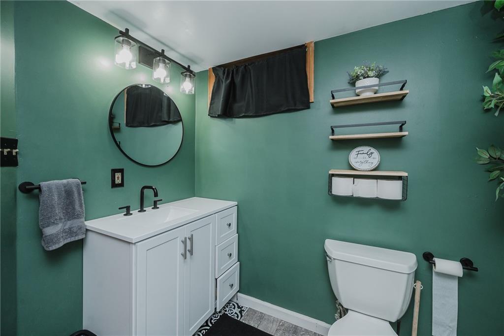 426 Grant Street Indiana, PA 15701 - Photo 23 of 33 a bathroom with a toilet sink and mirror