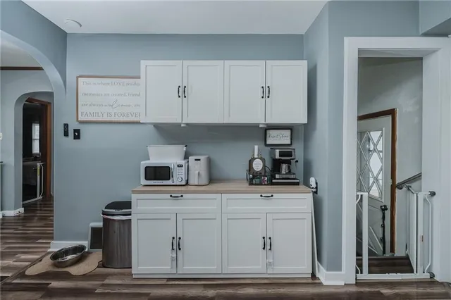 a kitchen with a stove and cabinets