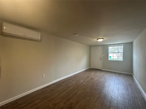 a view of a bathroom from a hallway