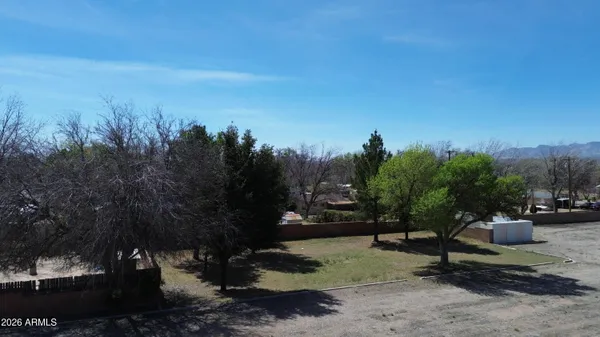 a view of a street with cars parked