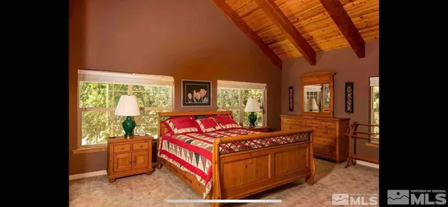 a bed room with a bed and a window