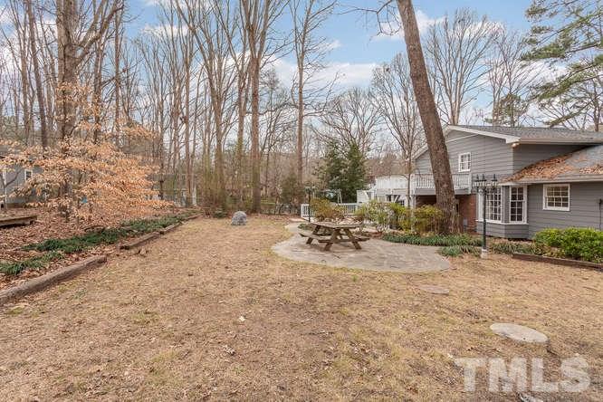 1612 Stonehurst Road Raleigh, NC 27607 - Photo 22 of 25 a view of a yard with a tree