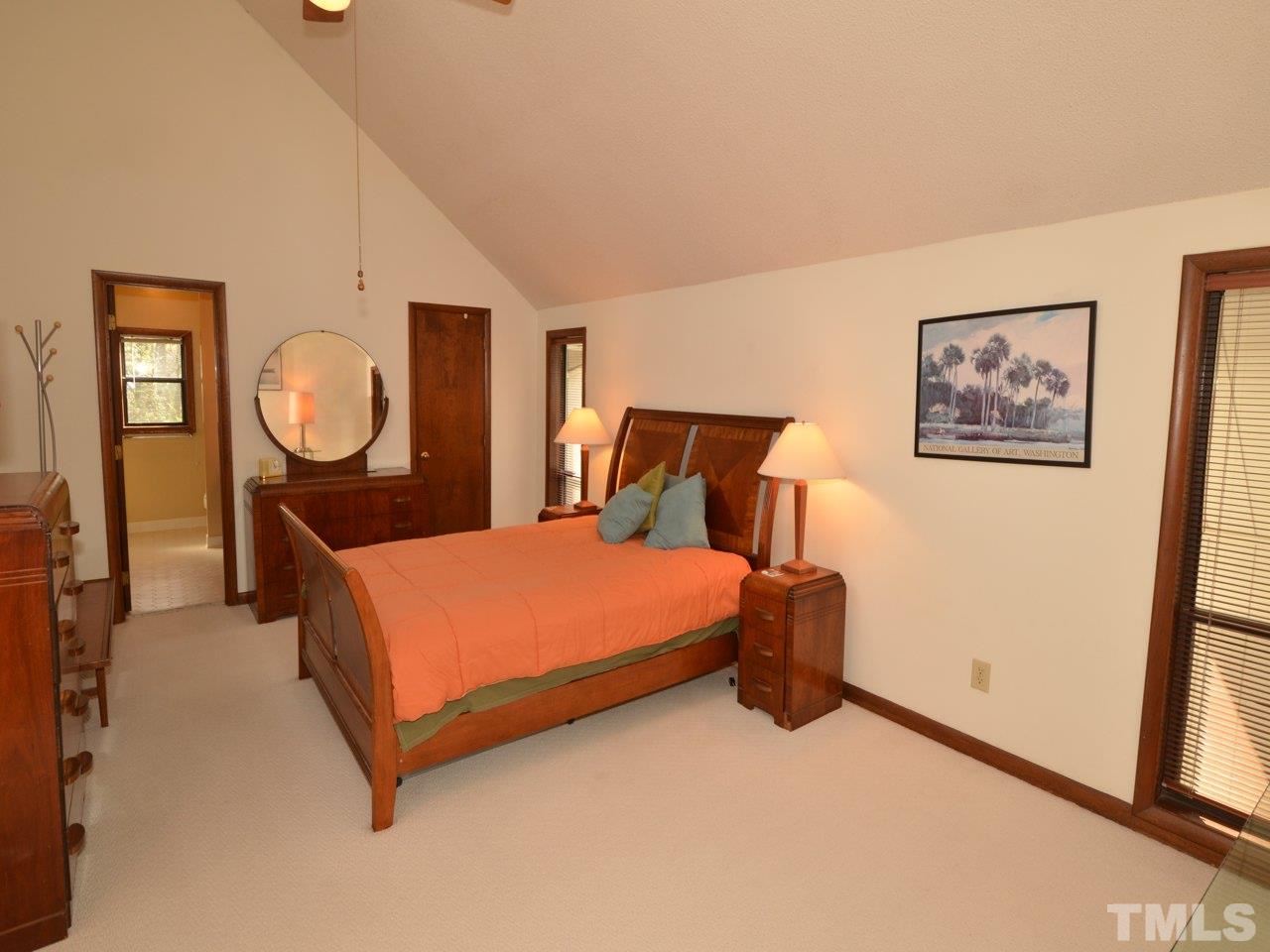 2812 Old Orchard Road Raleigh, NC 27607 - Photo 11 of 25 a bed room with a bed and a painting