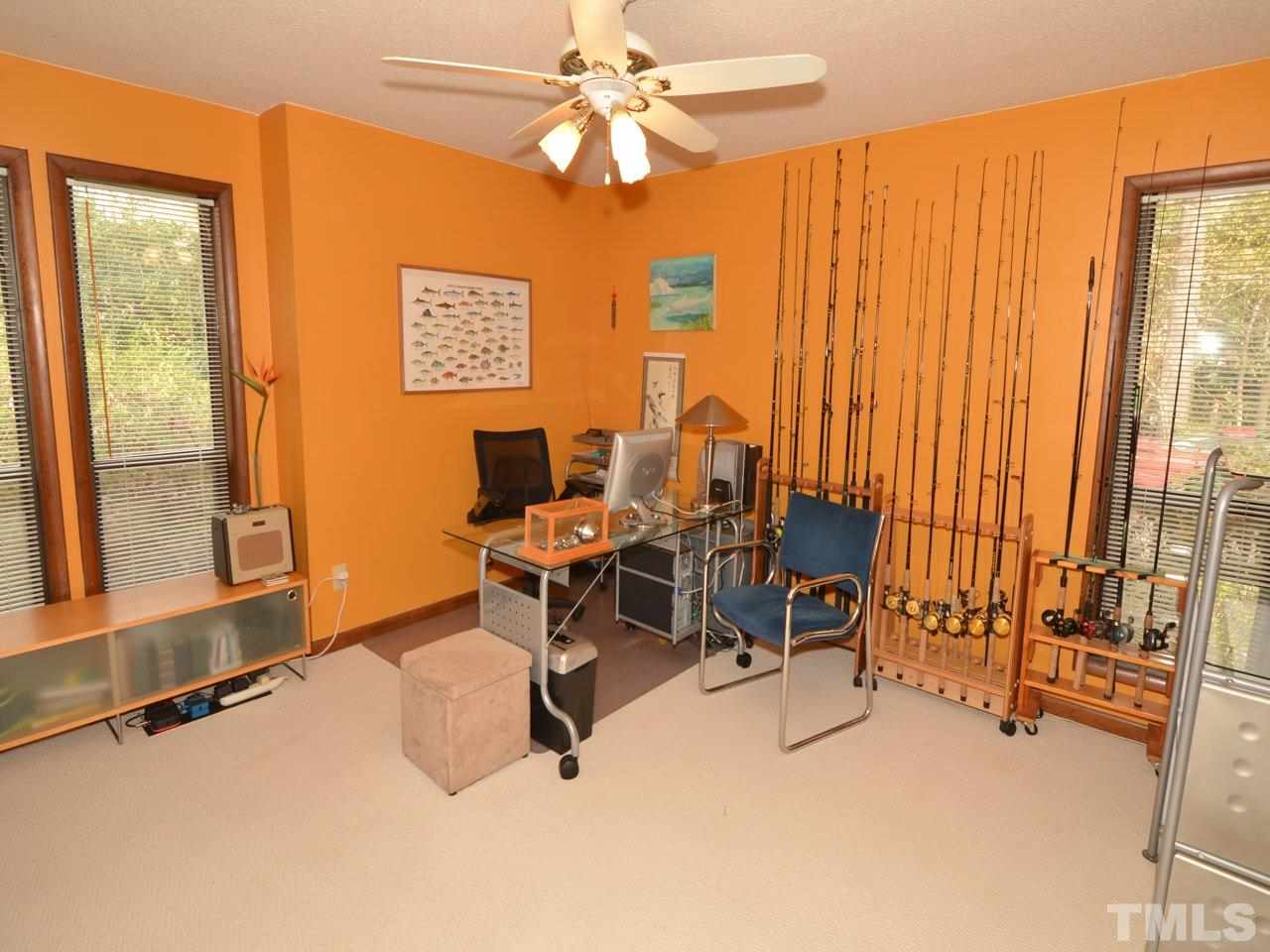 2812 Old Orchard Road Raleigh, NC 27607 - Photo 15 of 25 a view of a livingroom with workspace and a window