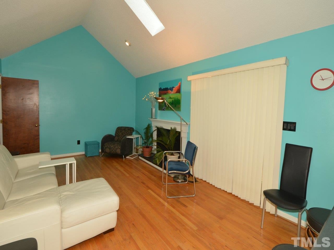 2812 Old Orchard Road Raleigh, NC 27607 - Photo 7 of 25 a workspace with furniture hardwood and a kitchen