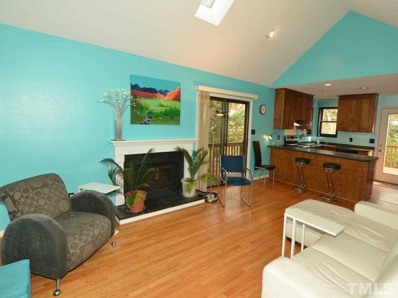 2812 Old Orchard Road Raleigh, NC 27607 - Photo 9 of 25 a living room with furniture and a fireplace