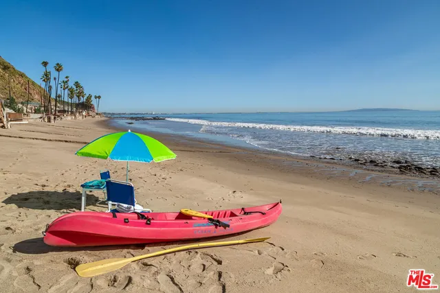 a bed room with a bed and a large window