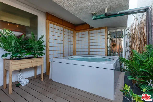 a view of bathroom with a potted plant
