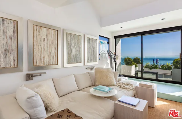 a kitchen with a sink a stove and chairs