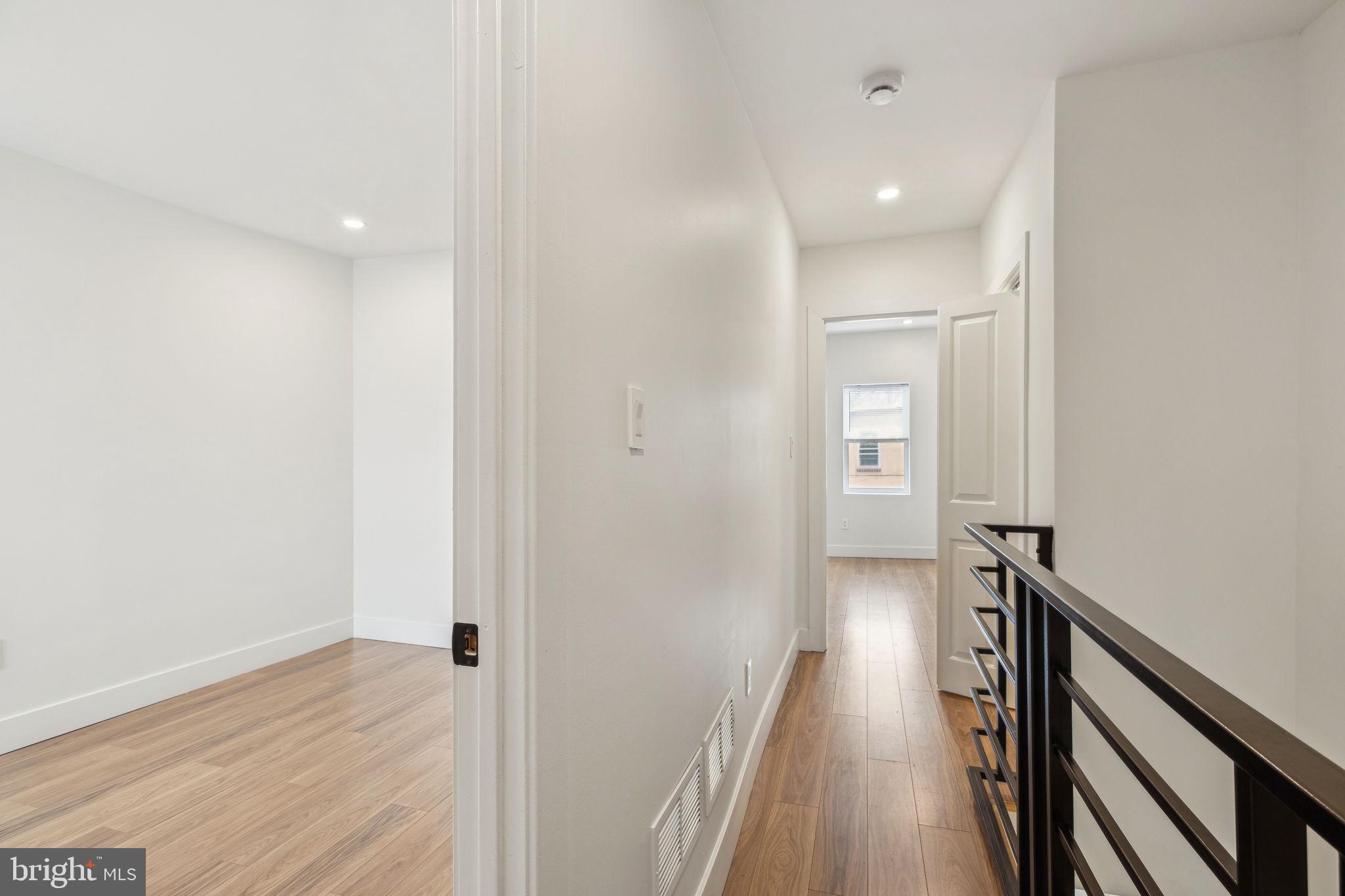2014 North 3rd Street, Unit B Philadelphia, PA 19122 - Photo 11 of 19 a view of a hallway with wooden floor and staircase