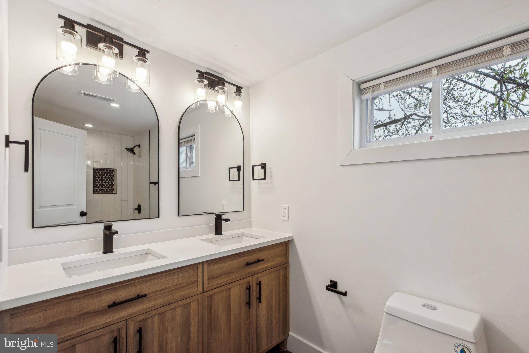 2014 North 3rd Street, Unit B Philadelphia, PA 19122 - Photo 13 of 19 a bathroom with a double vanity sink and a mirror