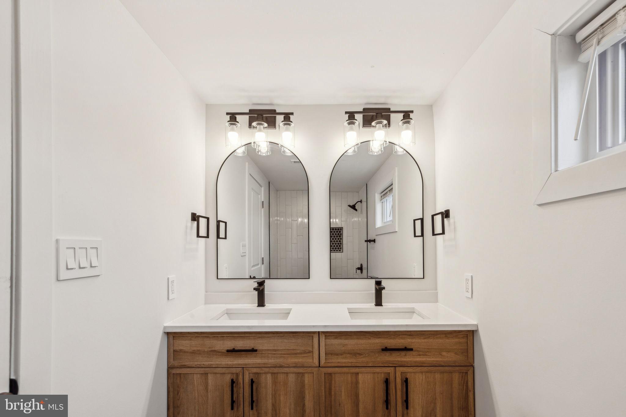 2014 North 3rd Street, Unit B Philadelphia, PA 19122 - Photo 14 of 19 a bathroom with a double vanity sink and a mirror