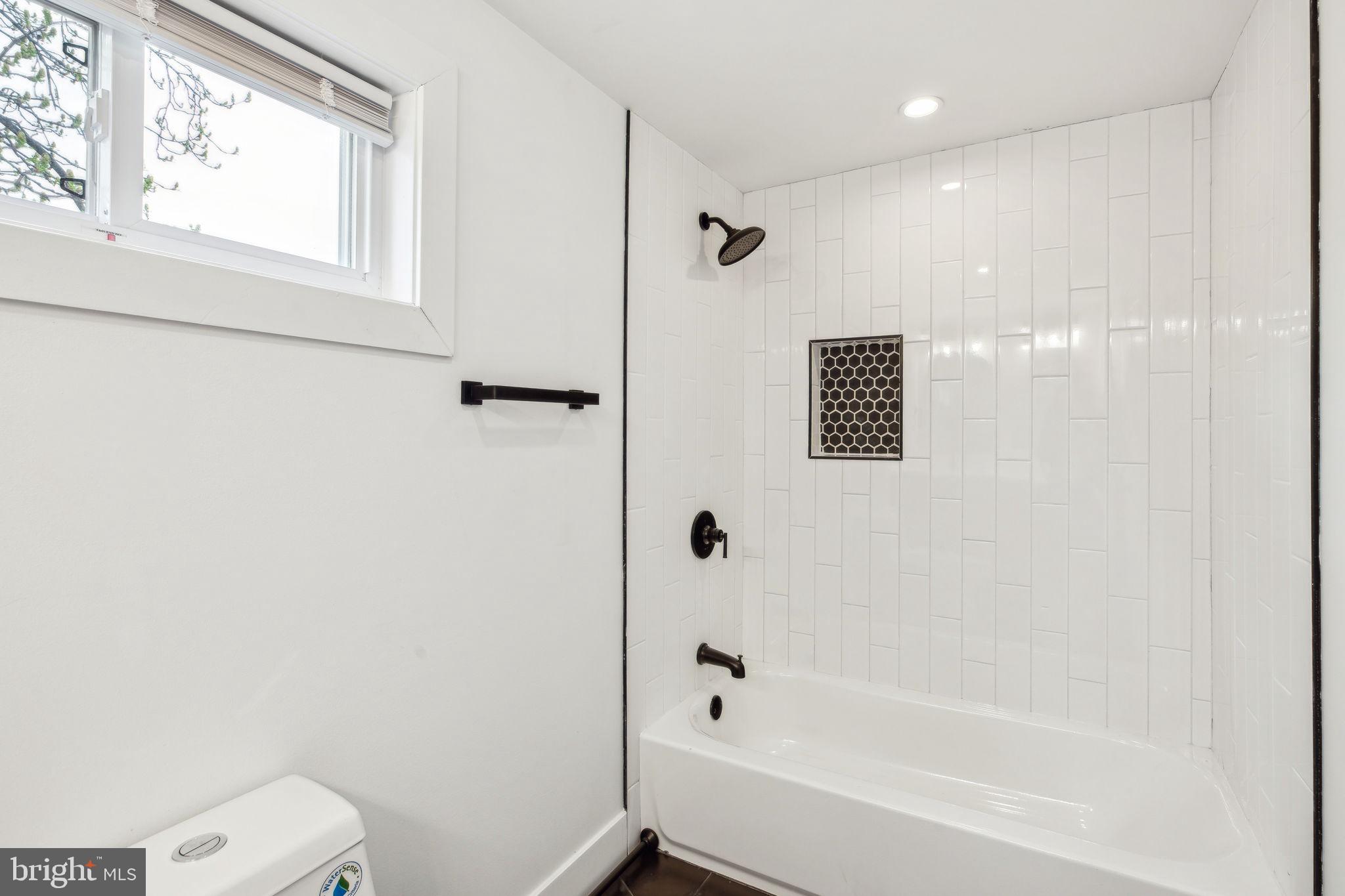 2014 North 3rd Street, Unit B Philadelphia, PA 19122 - Photo 15 of 19 a bathroom with a bathtub a toilet and a shower