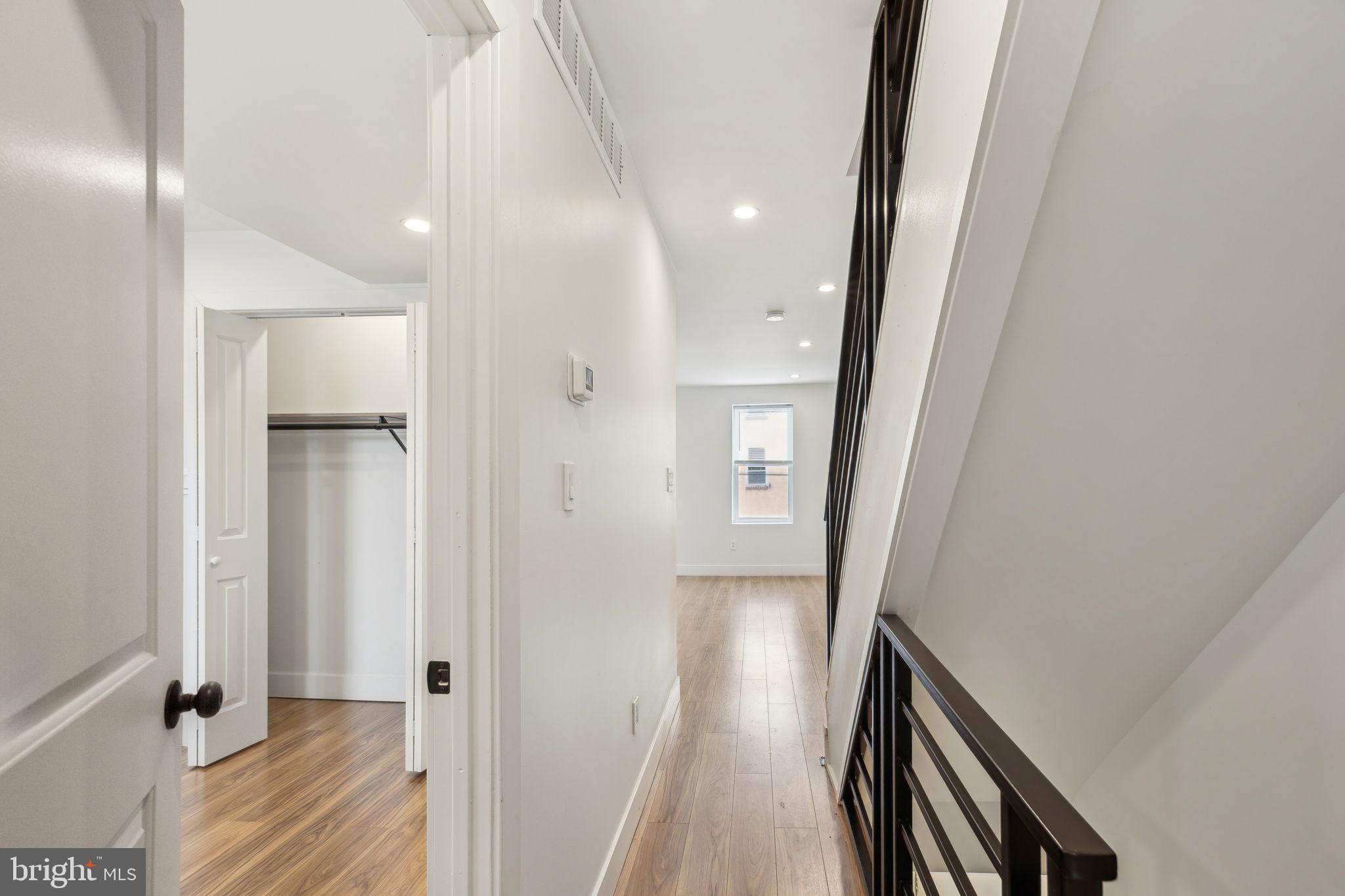 2014 North 3rd Street, Unit B Philadelphia, PA 19122 - Photo 3 of 19 a view of a hallway with wooden floor and staircase