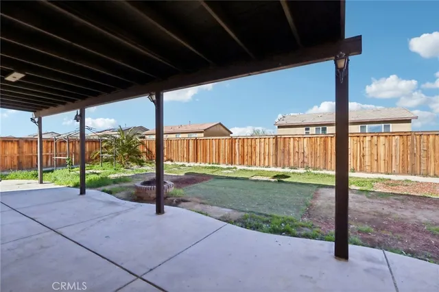 a view of a porch with wooden fence