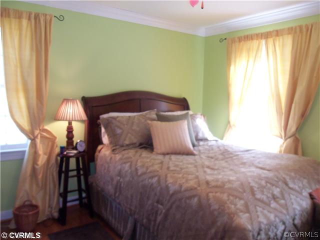 3020 Vistapoint Road Midlothian, VA 23113 - Photo 19 of 24 a large bed sitting in a bedroom next to a window