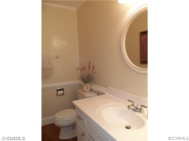 3020 Vistapoint Road Midlothian, VA 23113 - Photo 7 of 24 a bathroom with a sink and a mirror