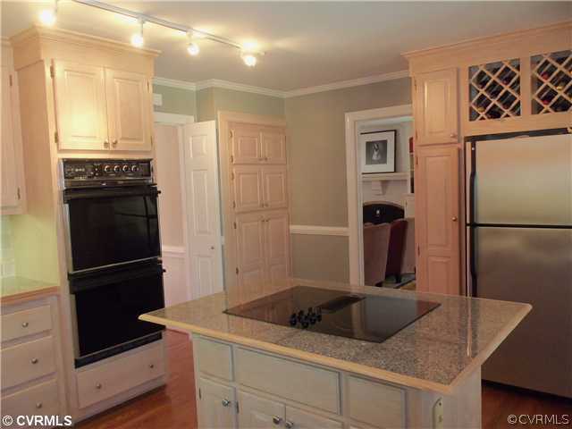 3020 Vistapoint Road Midlothian, VA 23113 - Photo 9 of 24 a kitchen with a refrigerator and a sink