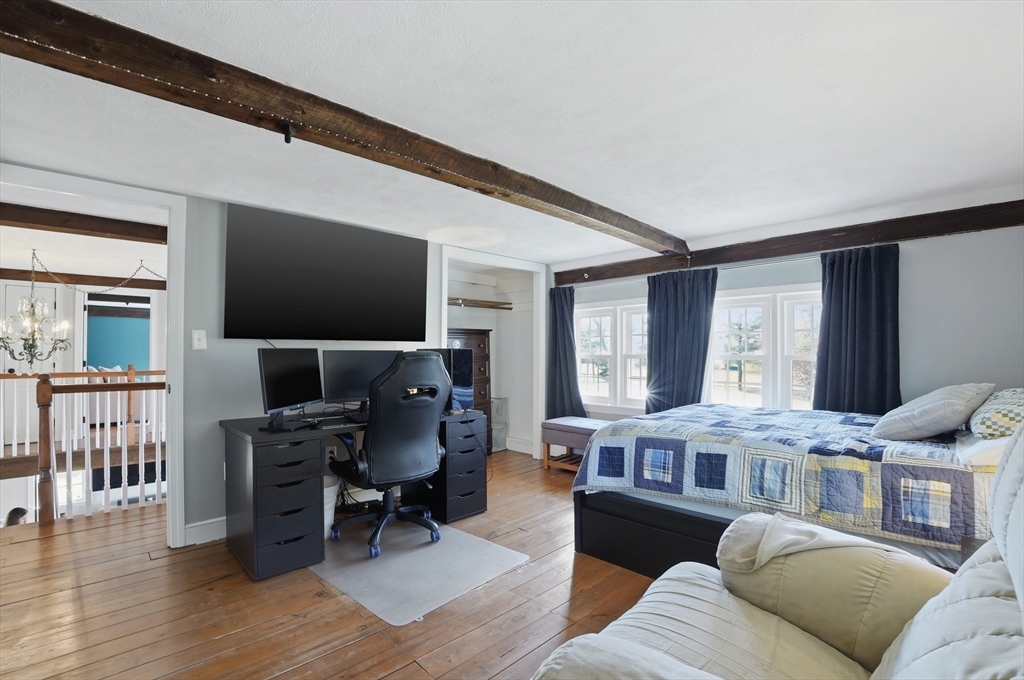 61 Main Street Hanover, MA 02339 - Photo 24 of 38 a living room with furniture and a flat screen tv
