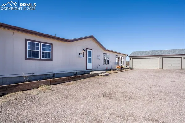 a house with trees in front of it