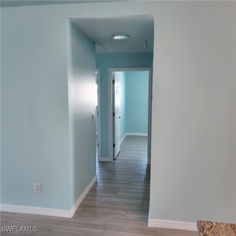 5651 Genesee Parkway, Unit 5651 Bokeelia, FL 33922 - Photo 12 of 27 a view of hallway with wooden floor