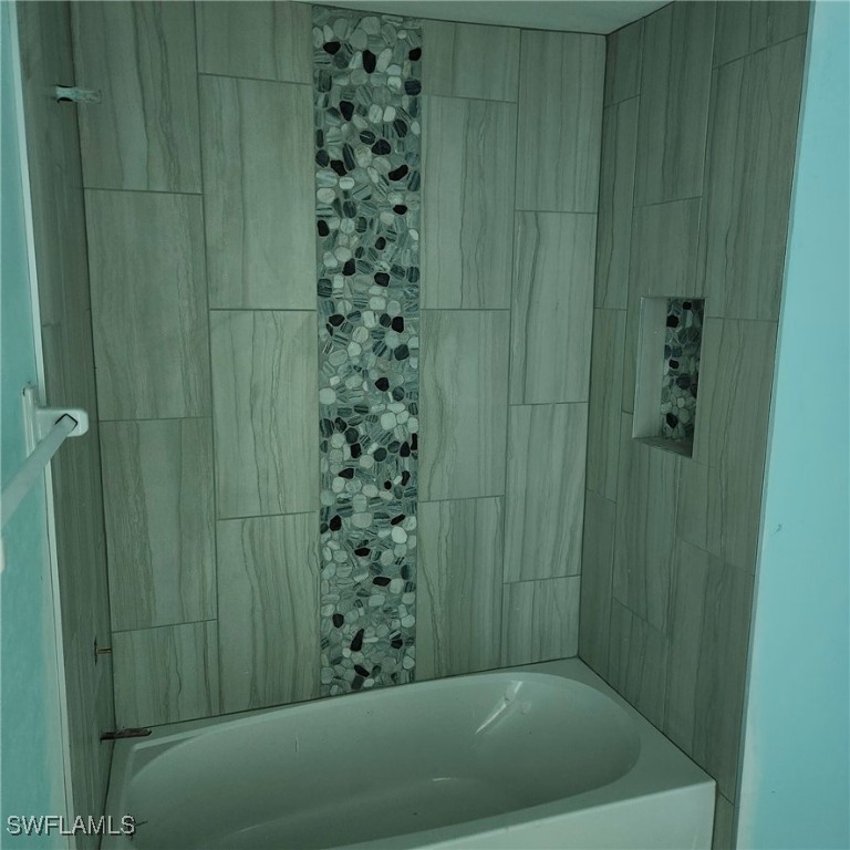 5651 Genesee Parkway, Unit 5651 Bokeelia, FL 33922 - Photo 15 of 27 a bathroom with a shower and a sink