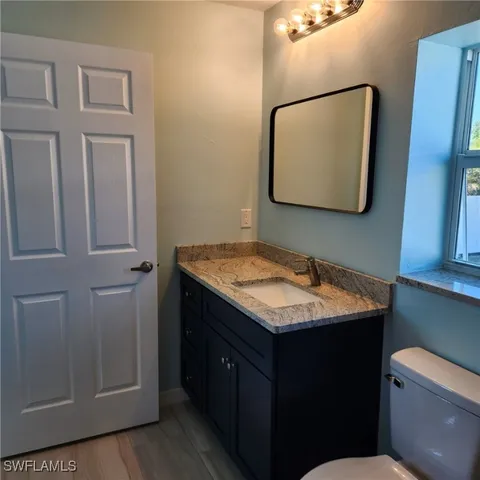 a bathroom with a glass shower door