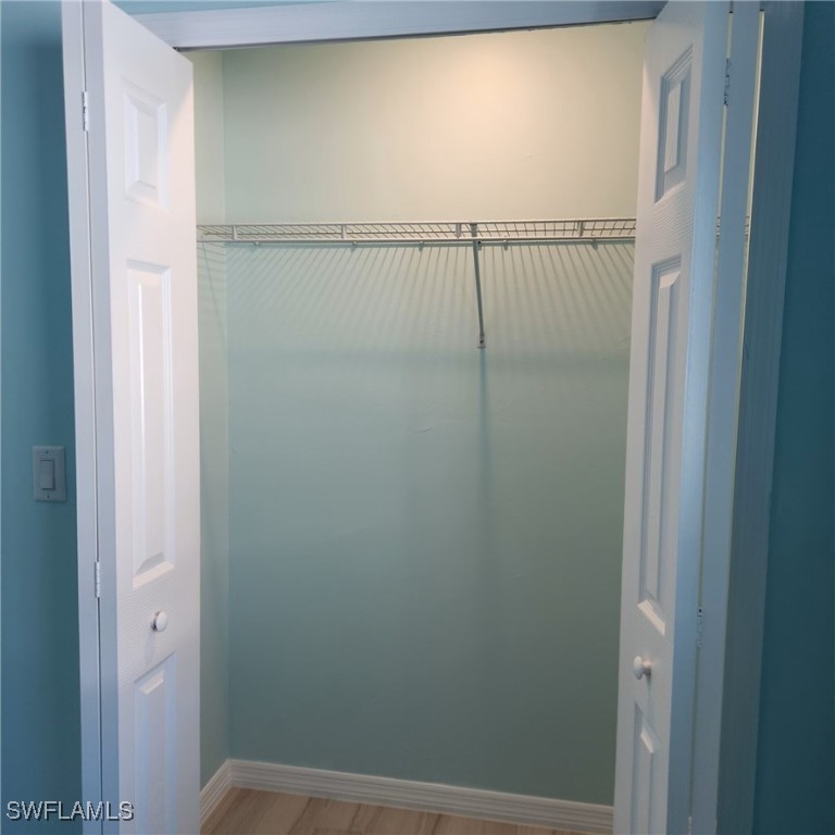 5651 Genesee Parkway, Unit 5651 Bokeelia, FL 33922 - Photo 17 of 27 a bathroom with a glass shower door
