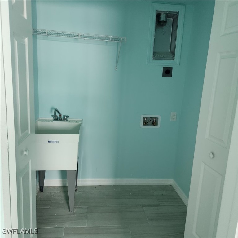 5651 Genesee Parkway, Unit 5651 Bokeelia, FL 33922 - Photo 18 of 27 a room with a table and a mirror