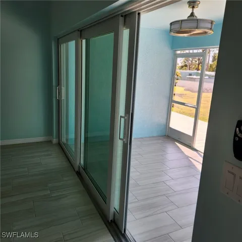 a view of a room with a sink and dryer
