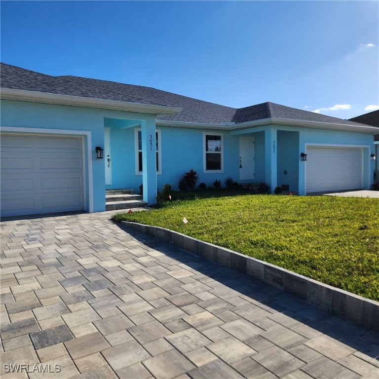 5651 Genesee Parkway, Unit 5651 Bokeelia, FL 33922 - Photo 4 of 27 a view of a house with a big yard