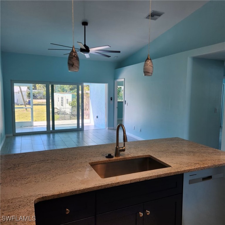 5651 Genesee Parkway, Unit 5651 Bokeelia, FL 33922 - Photo 10 of 27 a kitchen with a sink and wooden floor