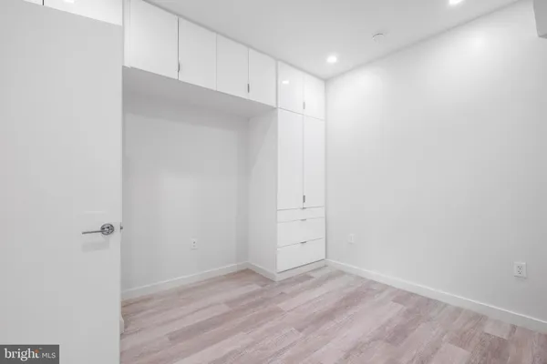 an empty room with wooden floor