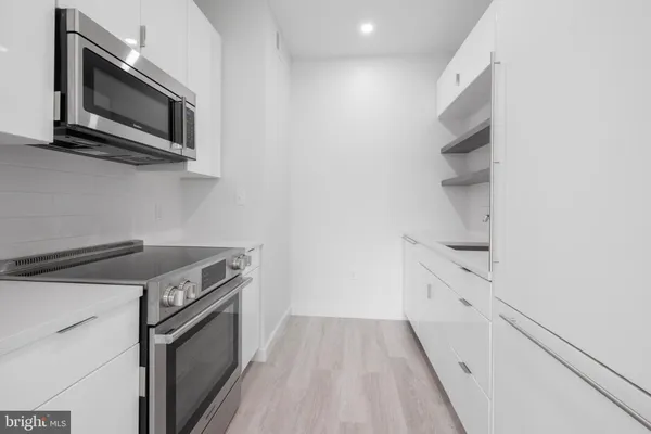 a kitchen with a stove and a microwave