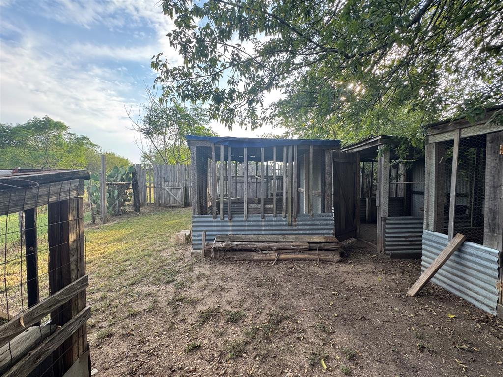 608 Cherokee Street Bellmead, TX 76705 - Photo 14 of 38 a backyard of a house with barbeque oven fire pit and outdoor seating