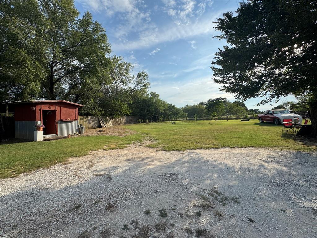 608 Cherokee Street Bellmead, TX 76705 - Photo 3 of 38 a view of a house with backyard and garden