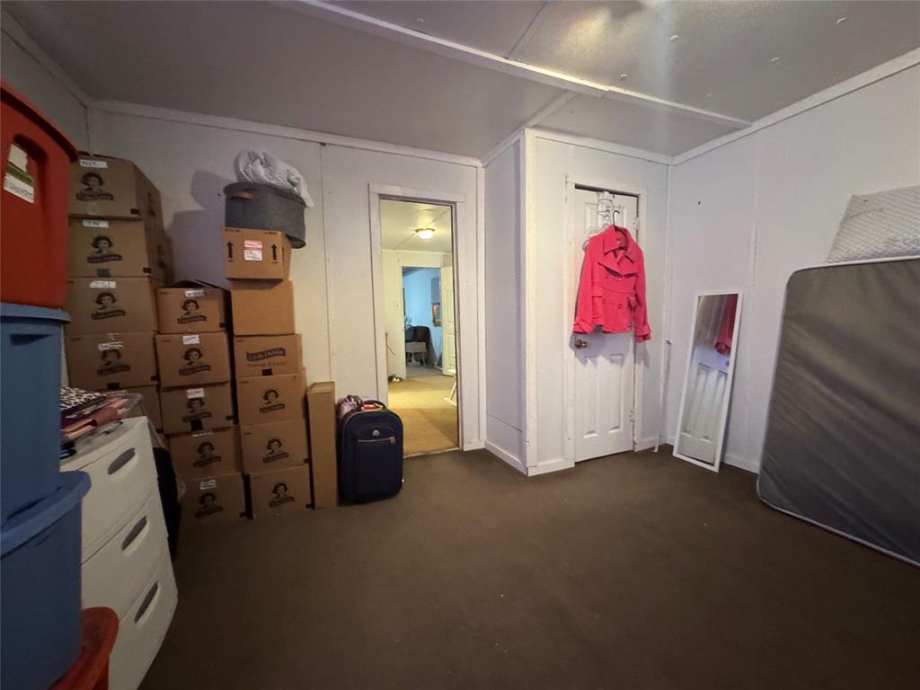 608 Cherokee Street Bellmead, TX 76705 - Photo 33 of 38 a view of walk in closet with clothes and shoes