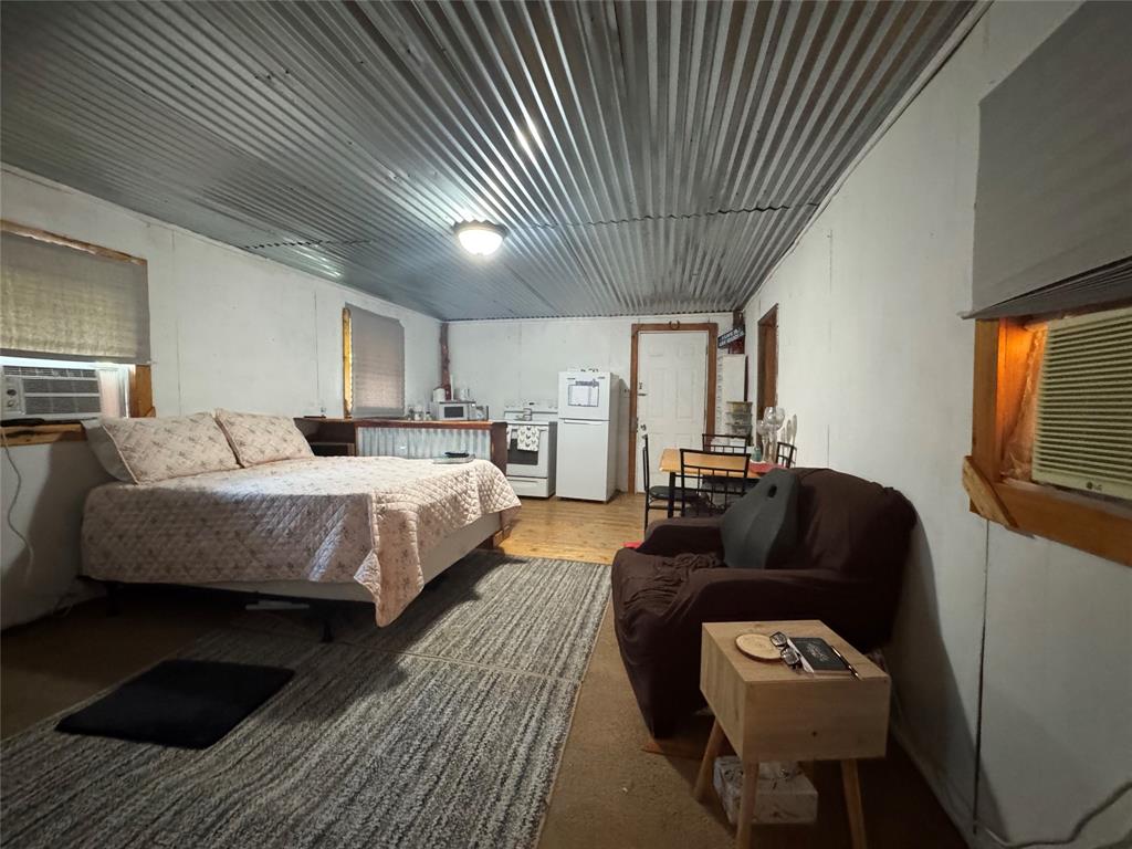 608 Cherokee Street Bellmead, TX 76705 - Photo 35 of 38 a bedroom with bed and a couch