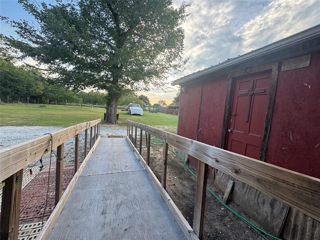 608 Cherokee Street Bellmead, TX 76705 - Photo 36 of 38 a view of deck with wooden floor and fence