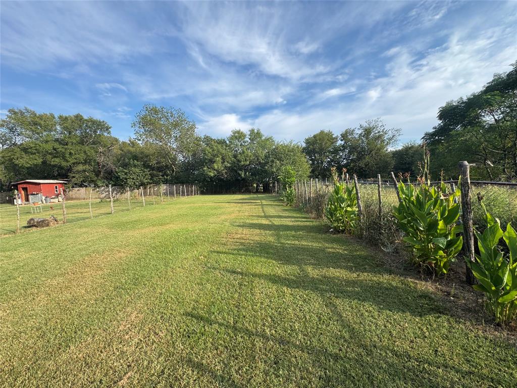 608 Cherokee Street Bellmead, TX 76705 - Photo 10 of 38 a view of a golf course with a lake