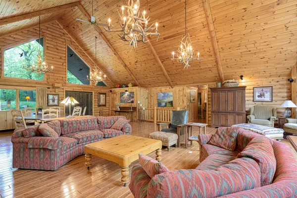 a living room with fireplace furniture and a flat screen tv