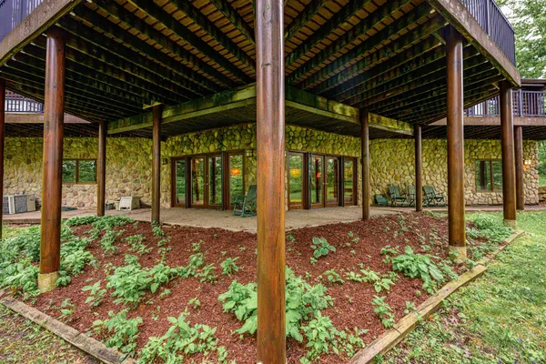 a view of a house with a yard and deck