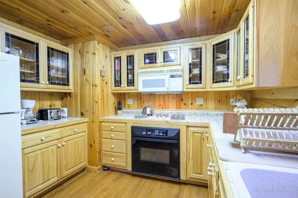 a kitchen with stainless steel appliances granite countertop a stove and a sink