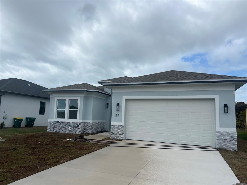 187 Sesame Road East Rotonda West, FL 33947 - Photo 1 of 28 a house view with a outdoor space