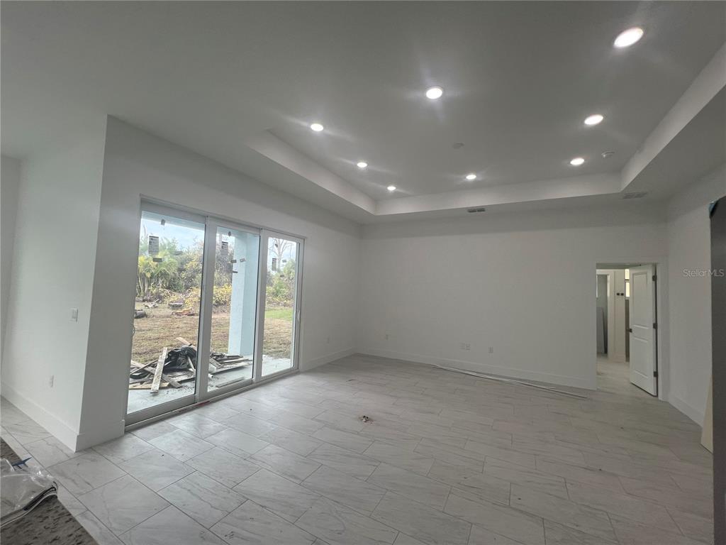 187 Sesame Road East Rotonda West, FL 33947 - Photo 11 of 28 a view of an empty room with a large window