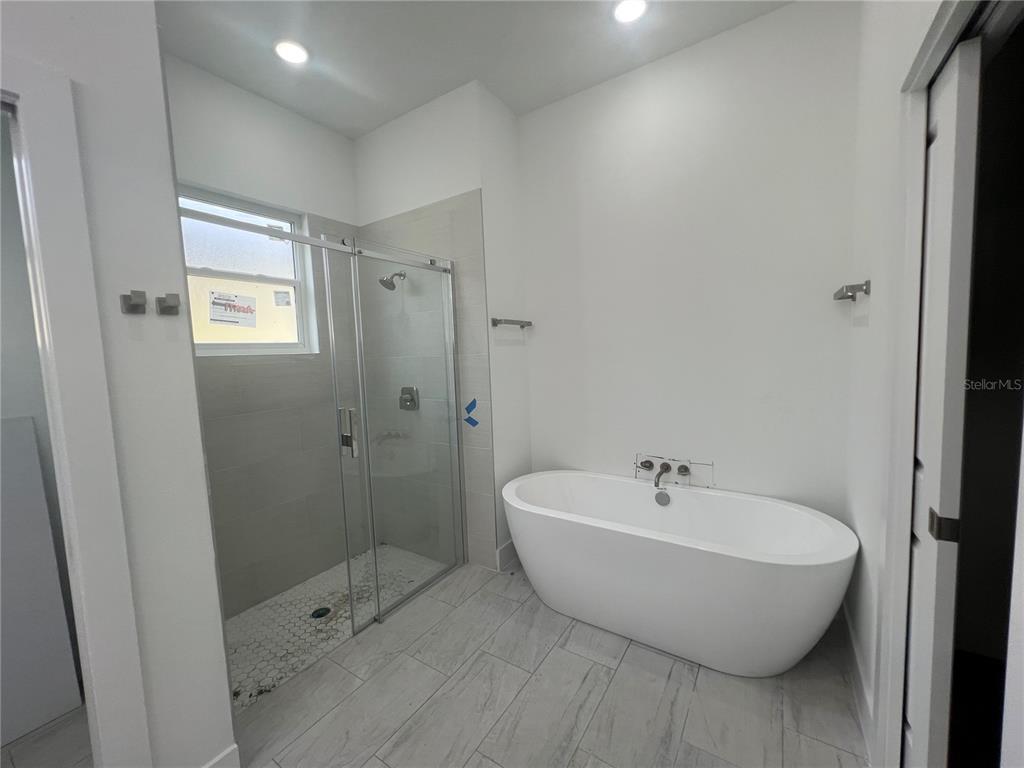 187 Sesame Road East Rotonda West, FL 33947 - Photo 15 of 28 a spacious bathroom with a bathtub and shower