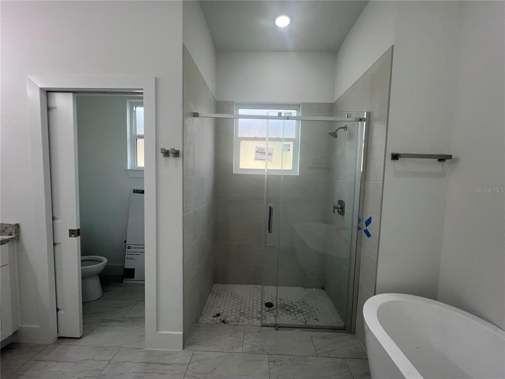 187 Sesame Road East Rotonda West, FL 33947 - Photo 16 of 28 a bathroom with a toilet and shower
