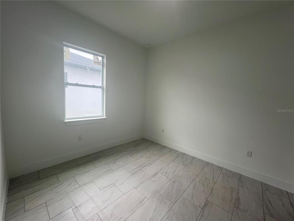 187 Sesame Road East Rotonda West, FL 33947 - Photo 20 of 28 an empty room with a window