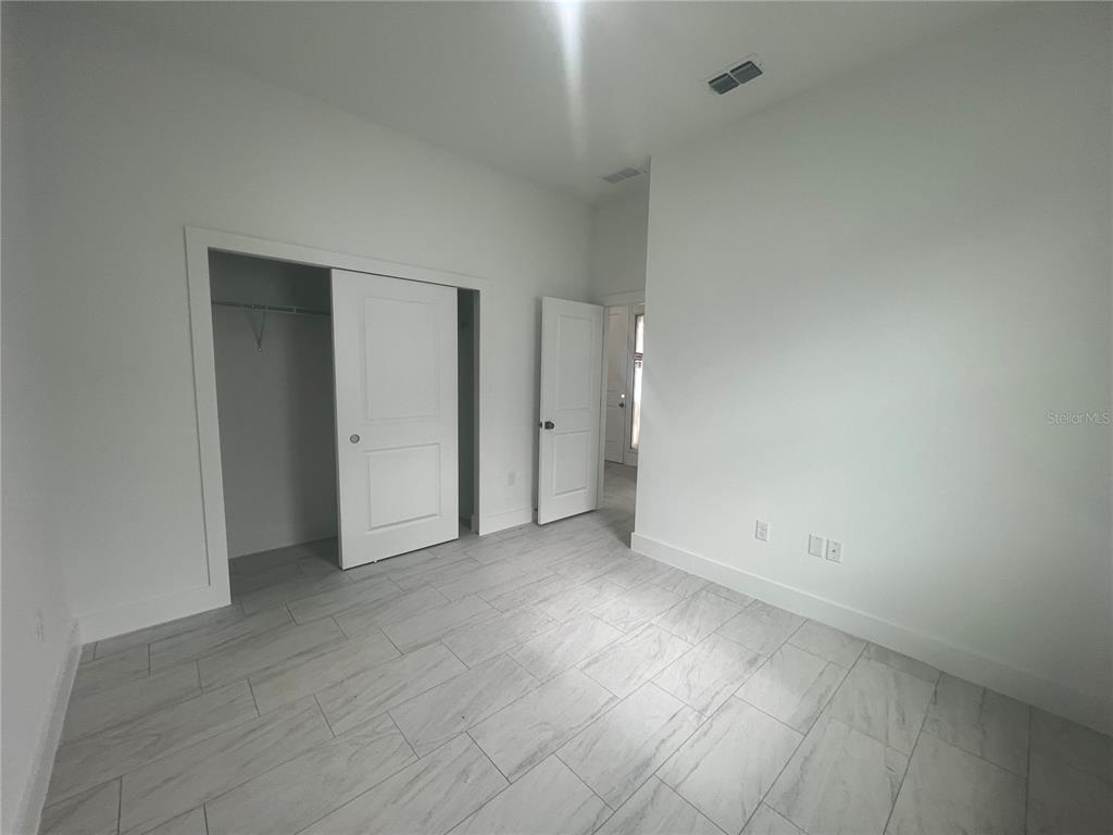 187 Sesame Road East Rotonda West, FL 33947 - Photo 21 of 28 an empty room with an entryway